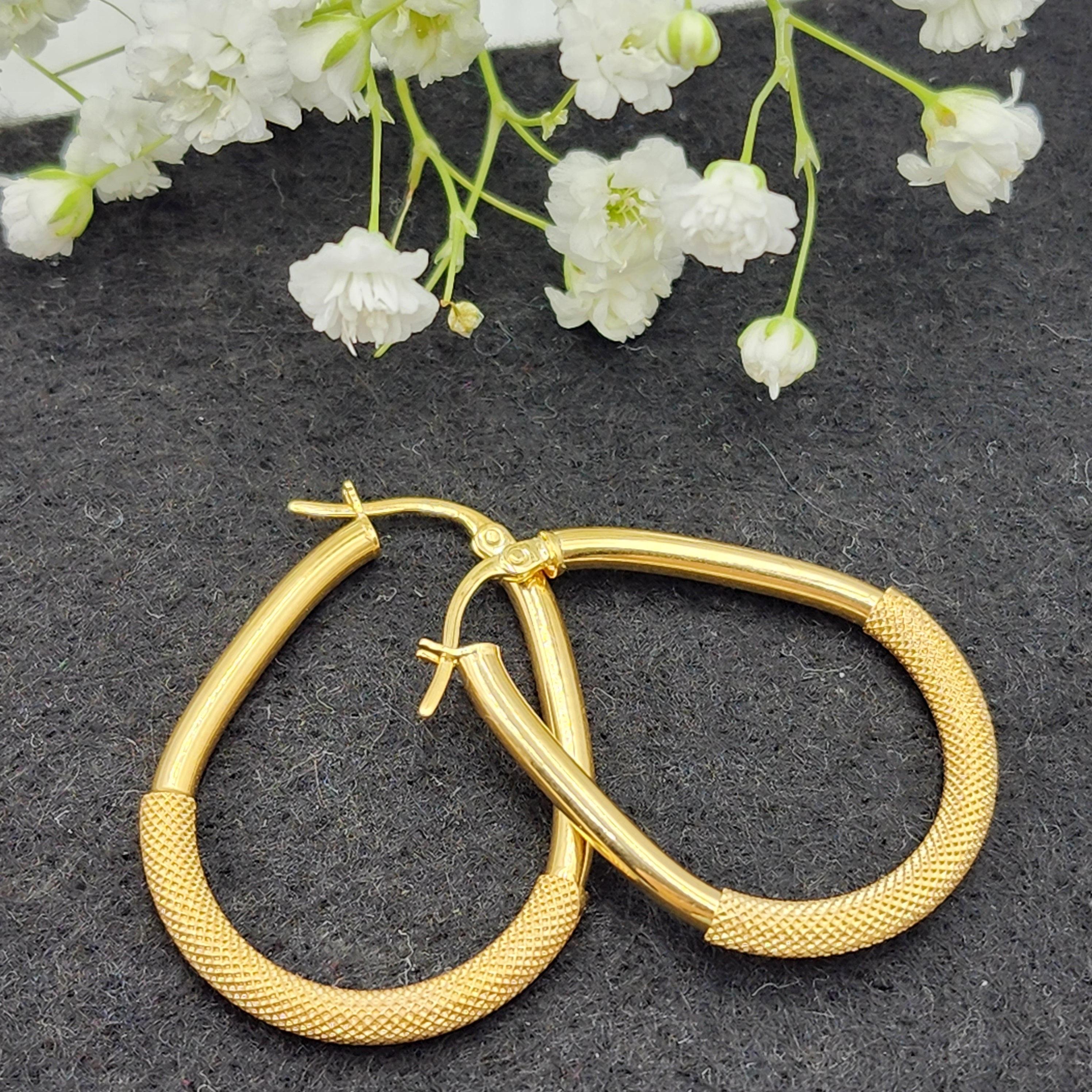 Elegant 10K Yellow Gold Textured Oval Hoop Earrings - Timeless Everyday Style.