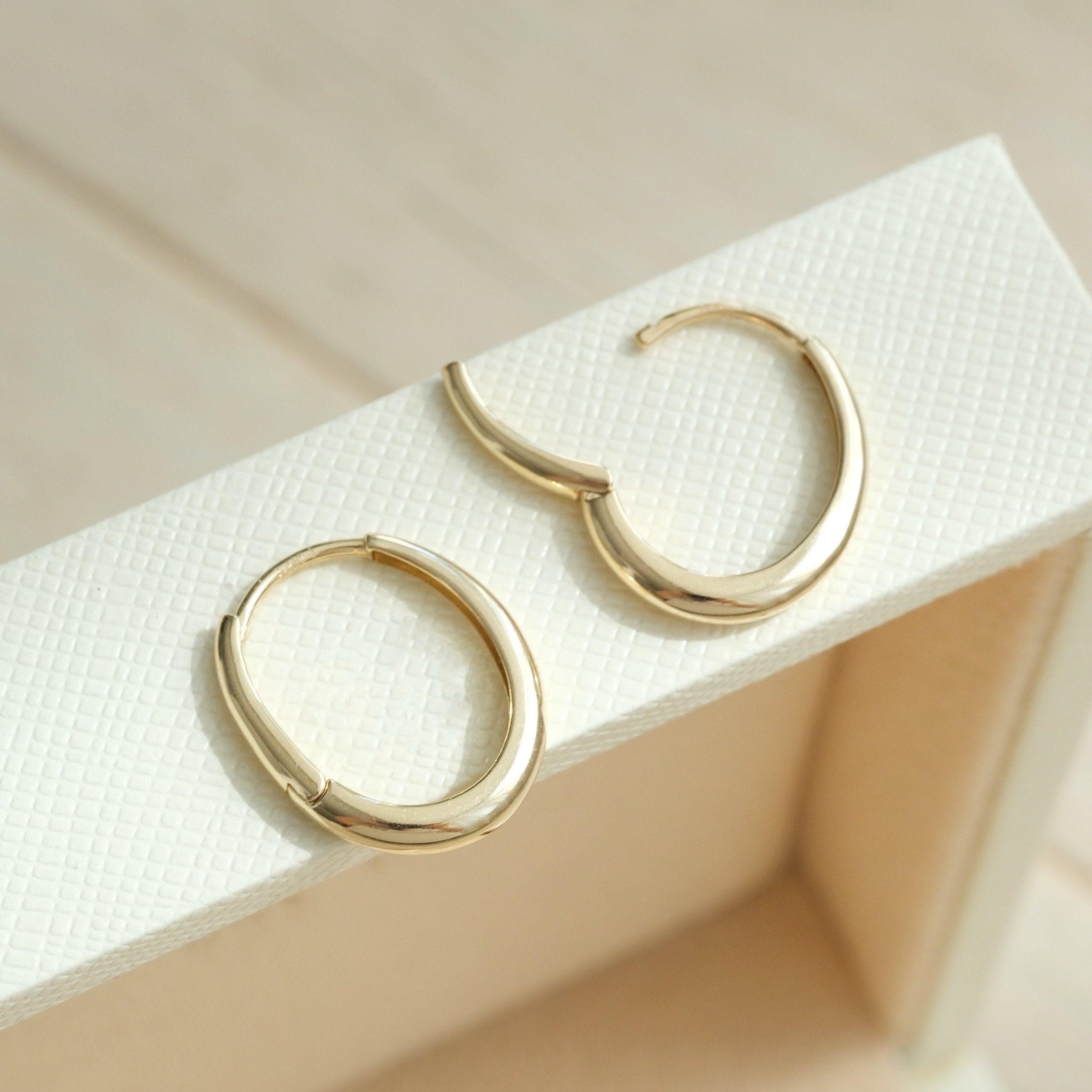 Dainty 14K Solid Gold Oval Hoop Earrings - Minimalist Skinny Huggie Hoops for Everyday Elegance.