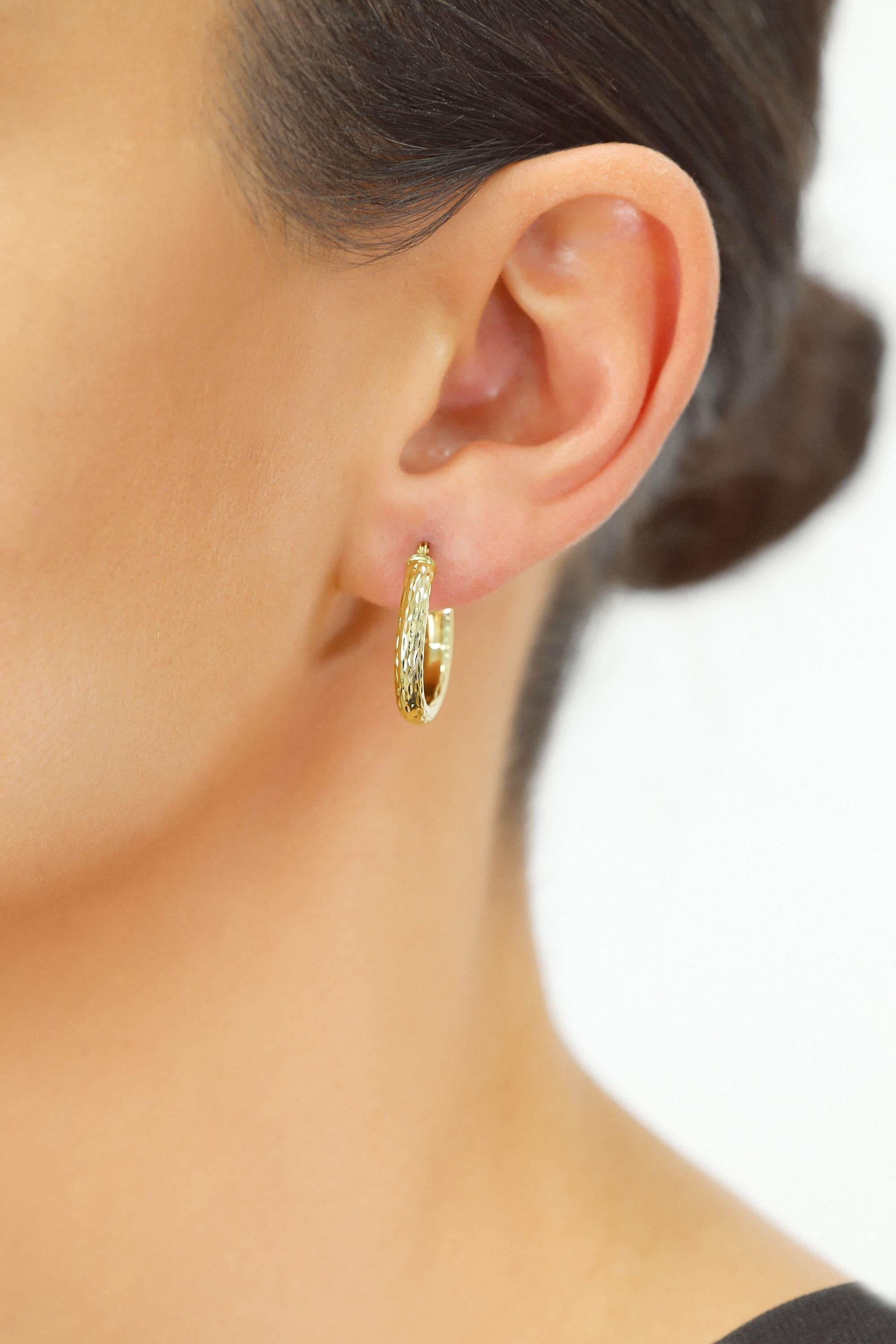 Luxurious 14K Solid Gold Hand-Engraved Diamond-Cut Oval Hoop Earrings.