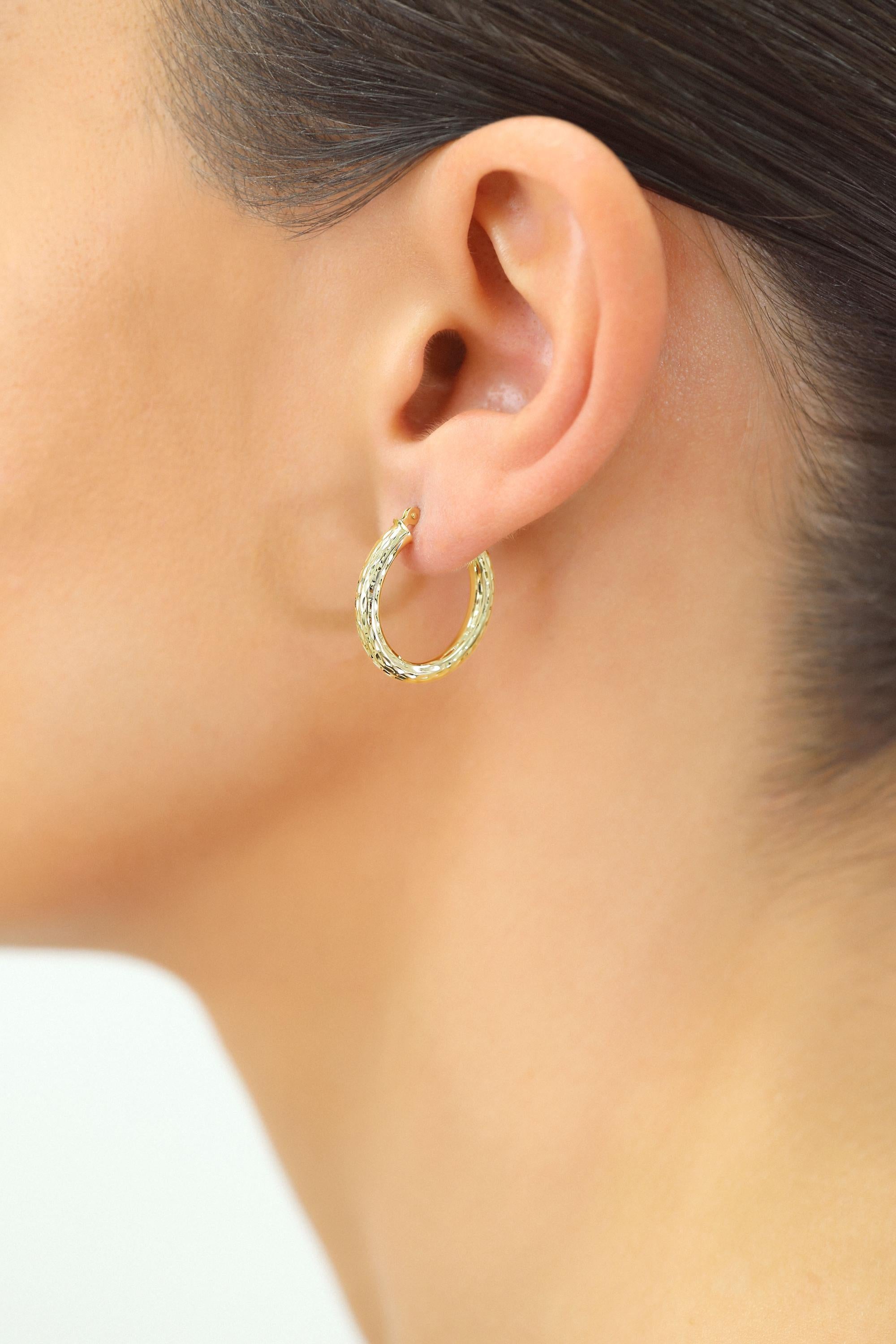 Luxurious 14K Solid Gold Hand-Engraved Diamond-Cut Oval Hoop Earrings.