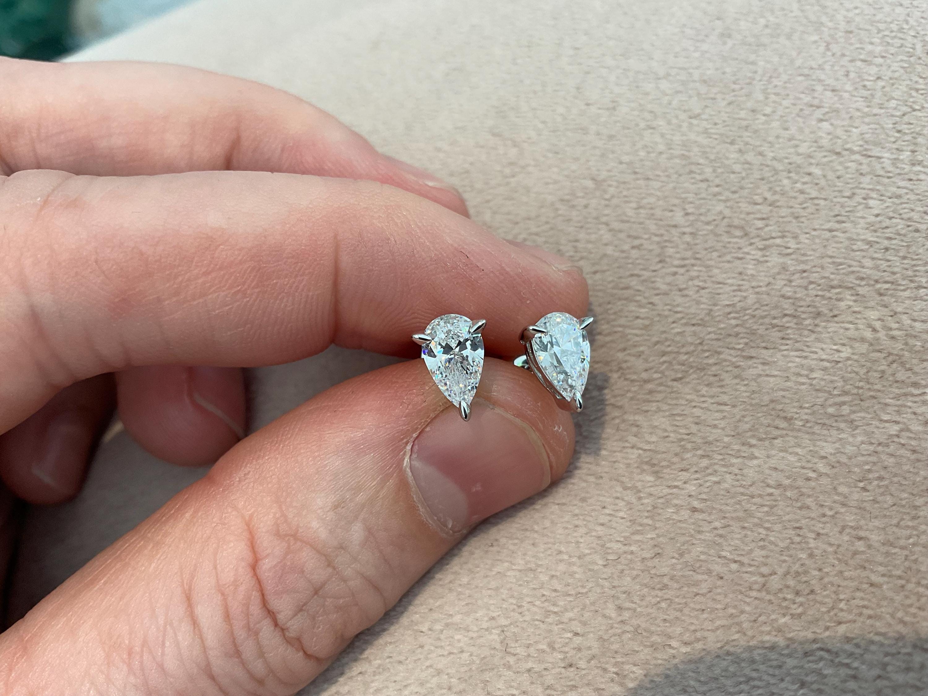 2.0 Carat Pear Cut Lab Created Diamond Earrings: Sterling Silver Platinum Overlay