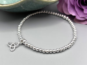 Elegant Sterling Silver Celtic Trinity Knot Bracelet with Trefoil Charm - Perfect Stacking Jewelry Gift.