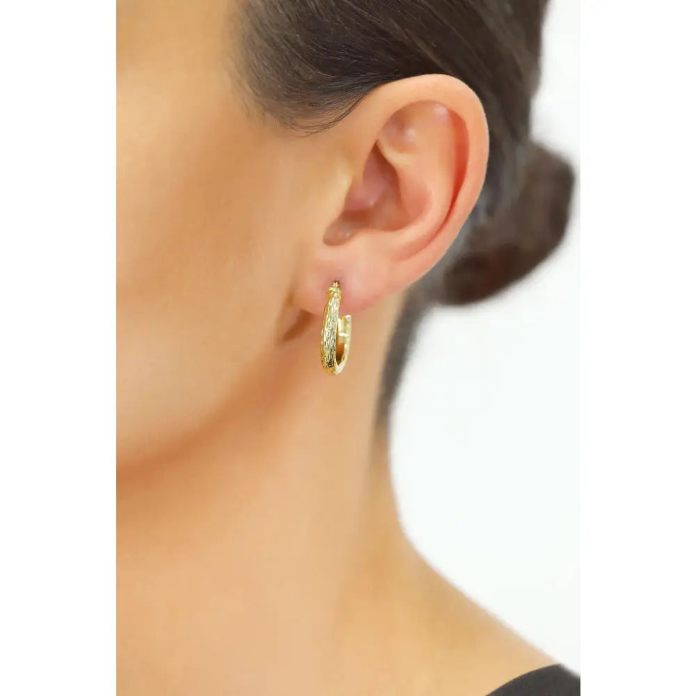 Luxurious 14K Solid Gold Hand-Engraved Diamond-Cut Oval Hoop Earrings.