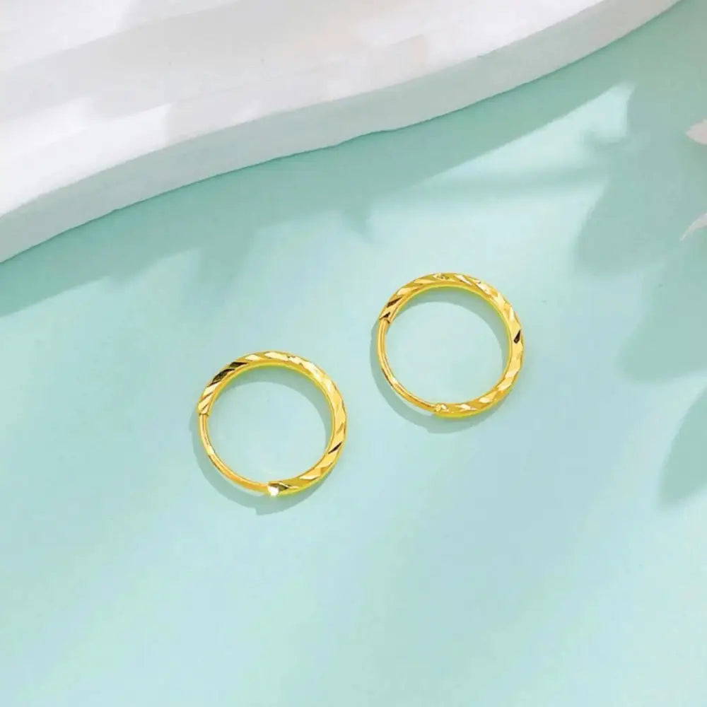 Luxurious 24K Gold Minimalist Wave Hoop Earrings for Elegant Women.