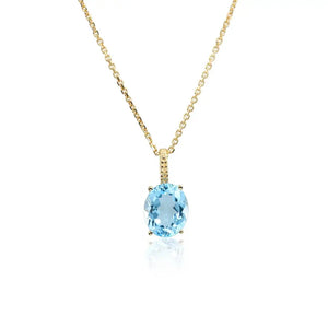Radiant 14K Yellow Gold Necklace with 6 Carat Oval Blue Topaz Pendant.
