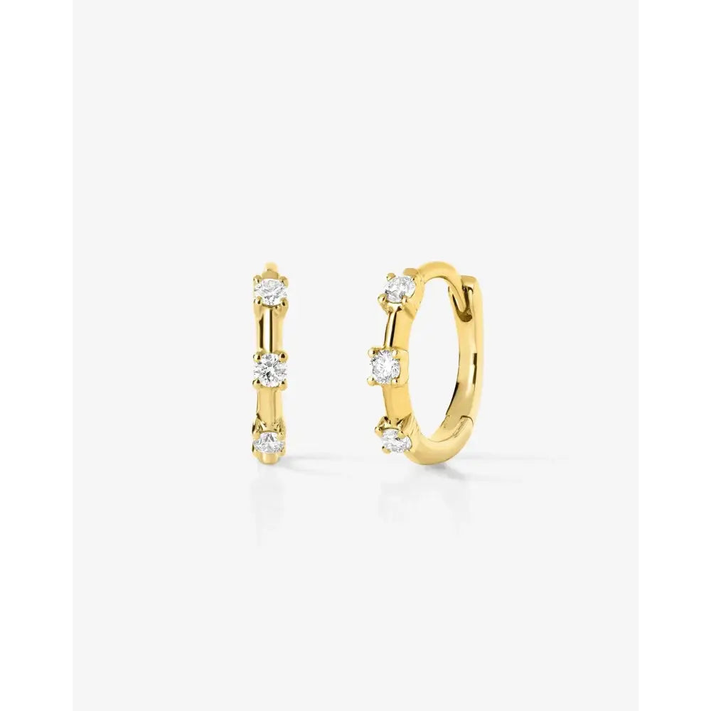 Sparkling Diamond Station Huggie Earrings - Elegant and Chic!.