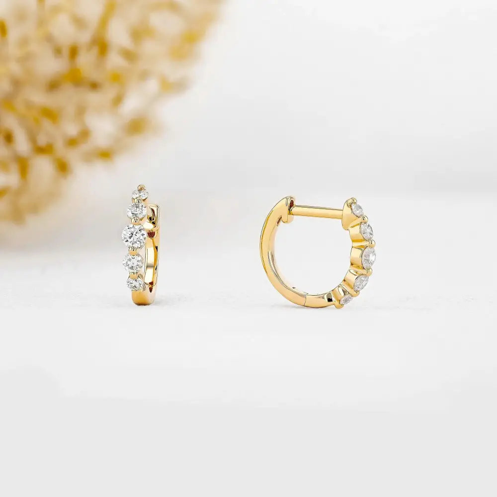 Stunning 14K Gold Diamond Graduated Huggie Hoop Earrings.