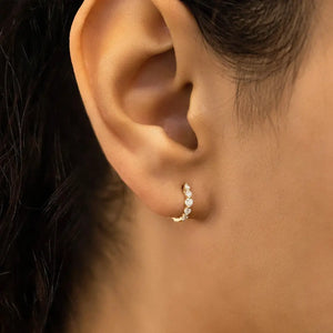 Stunning 14K Gold Diamond Graduated Huggie Hoop Earrings.