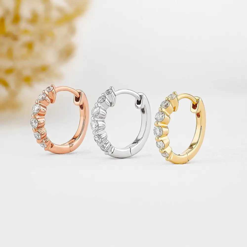 Stunning 14K Gold Diamond Graduated Huggie Hoop Earrings.