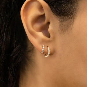 Stunning 14K Gold Diamond Graduated Huggie Hoop Earrings.