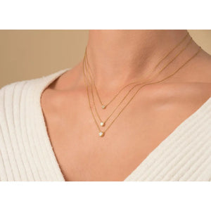 Elegant 14K Gold Diamond Solitaire Necklace - Minimalist Bezel Setting for Timeless Style.