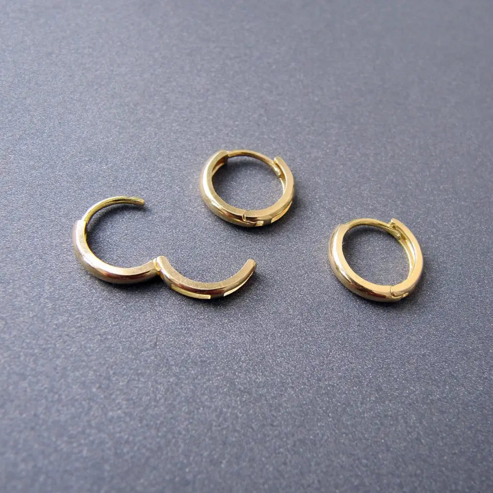 Stunning 14K Solid Gold Oval Hoop Earrings - Dainty Skinny Huggie Hoops for Elegant Women.