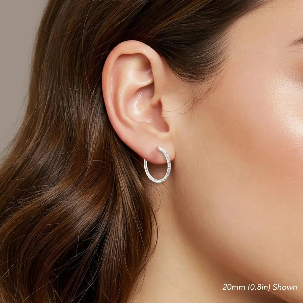 Stunning 14K White Gold Diamond-Cut Hoop Earrings - Elegant Hand-Engraved X-Pattern Available in Small, Medium, and Large Sizes.