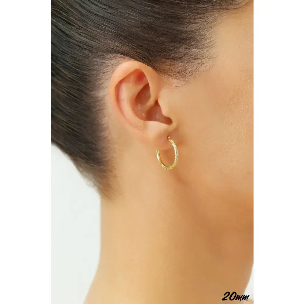 Stunning 14K Yellow Gold Diamond-Cut Hand Engraved "X-Pattern" Round Hoop Earrings - Available in Small, Medium, and Large by TILO Jewelry.