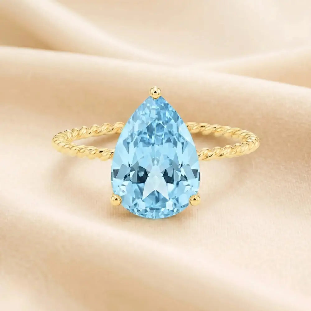 Stunning 14K Yellow Gold Pear-Cut Sky Blue Topaz Ring – The Perfect Elegant Birthstone Gift for Any Occasion.