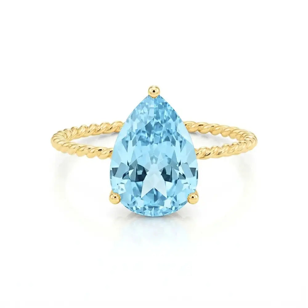 Stunning 14K Yellow Gold Pear-Cut Sky Blue Topaz Ring – The Perfect Elegant Birthstone Gift for Any Occasion.