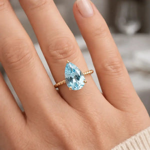 Stunning 14K Yellow Gold Pear-Cut Sky Blue Topaz Ring – The Perfect Elegant Birthstone Gift for Any Occasion.