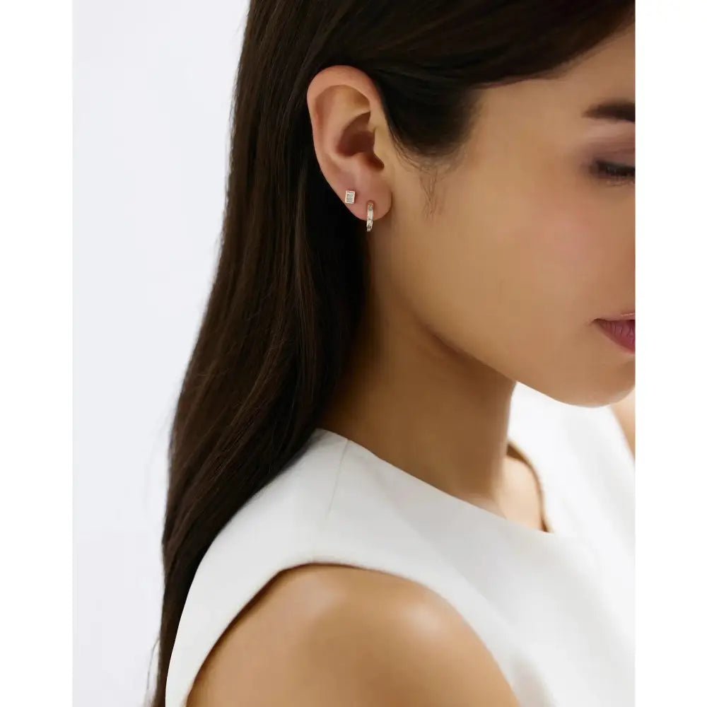 Stunning Baguette Channel-Set Huggie Earrings.