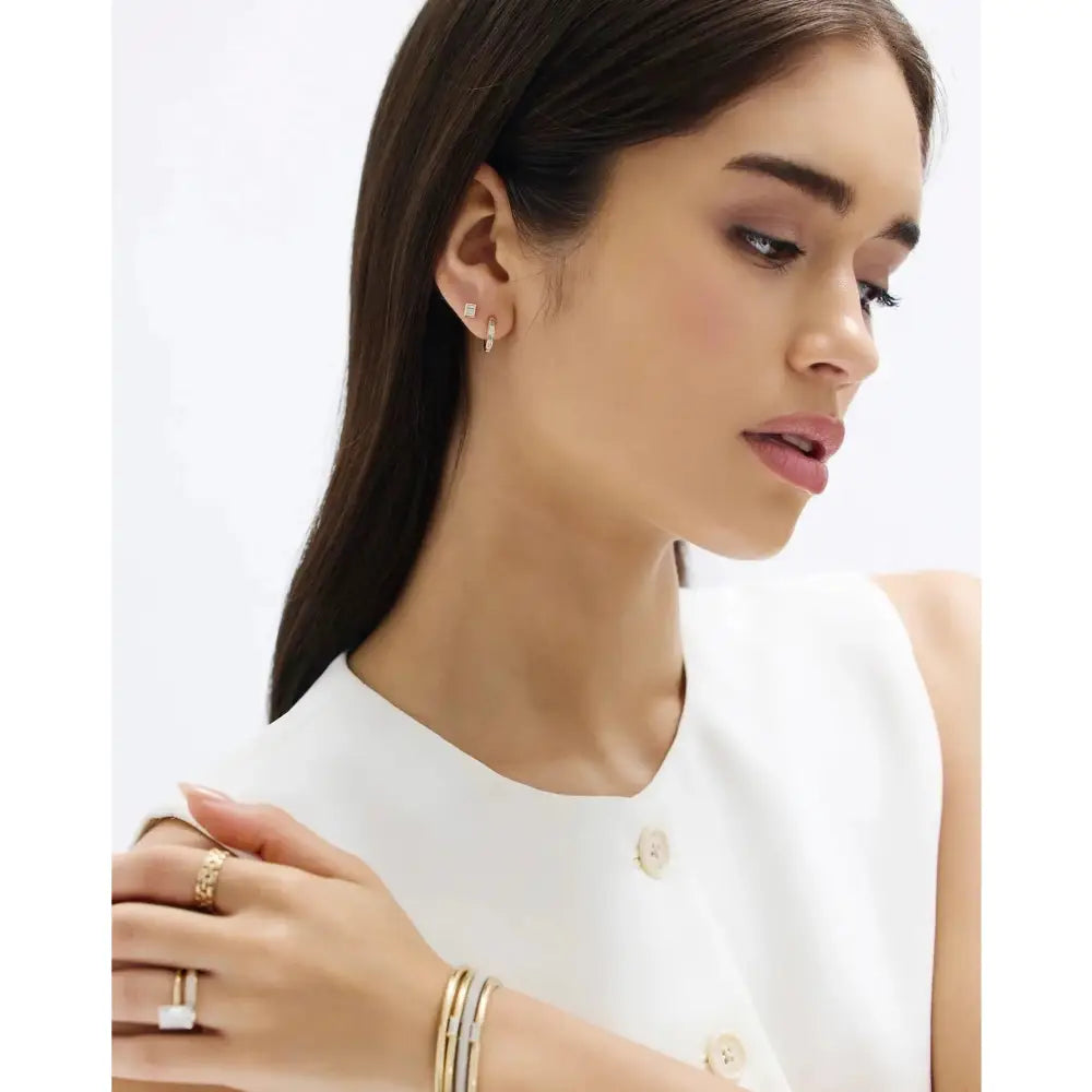 Stunning Baguette Channel-Set Huggie Earrings.