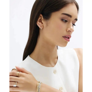 Stunning Baguette Channel-Set Huggie Earrings.